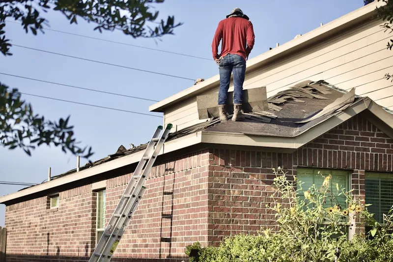 Professional roofer working on a residential roof in Downtown Leesburg